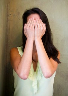 Woman shielding her face